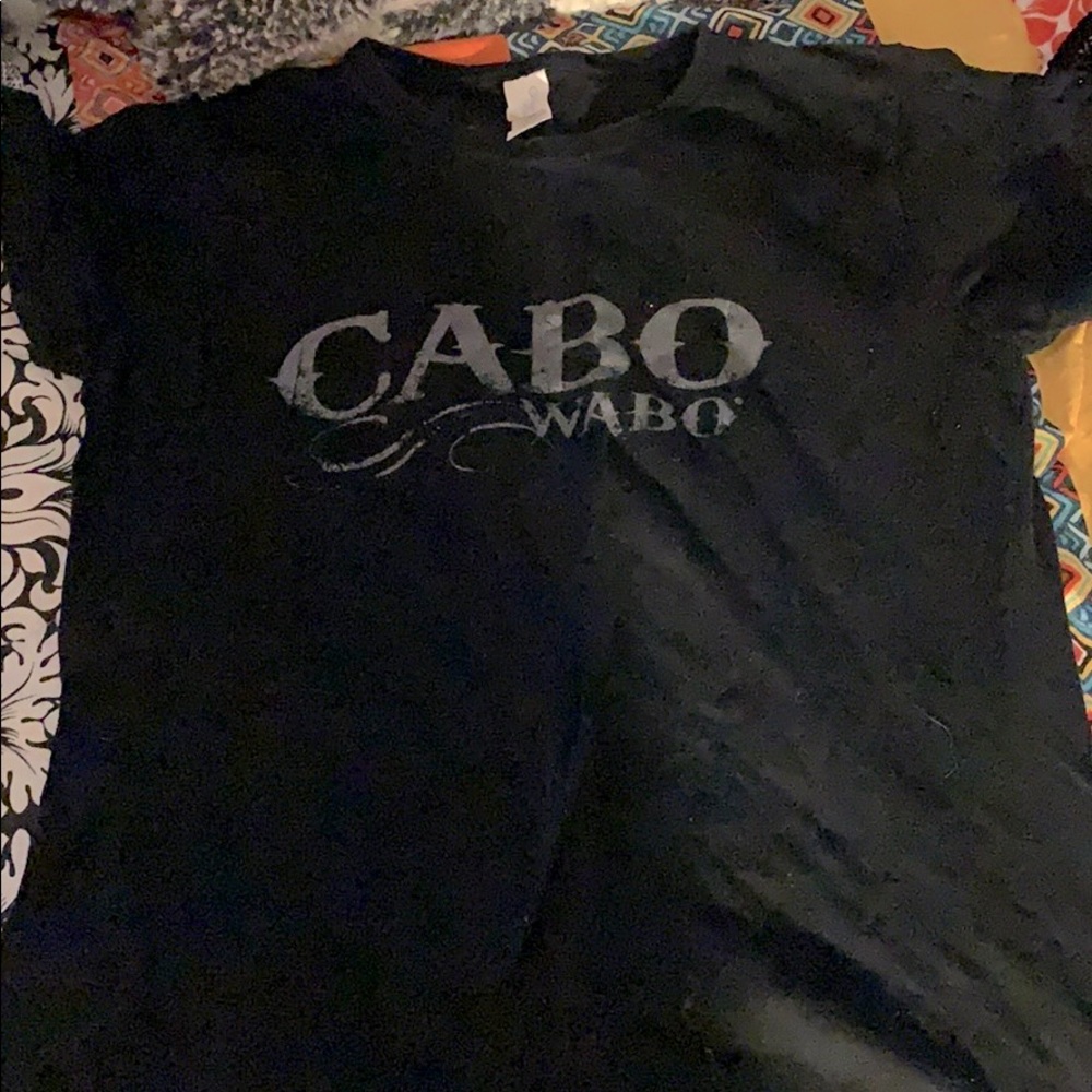 Black tshirt that says Cabo Wabo on the front